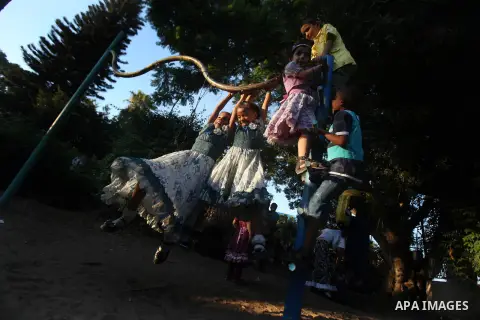 Palestinian children play at a park during the Second day of Eid al-Fitr in Gaza city, Aug. 20, 2012. which marks the end of the Muslim fasting month of Ramadan. Eid, one of the most important holidays in the Muslim worl...