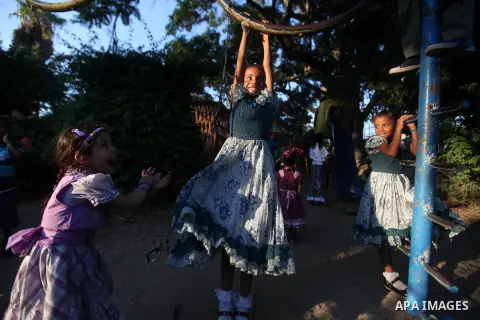Palestinian children play at a park during the Second day of Eid al-Fitr in Gaza city, Aug. 20, 2012. which marks the end of the Muslim fasting month of Ramadan. Eid, one of the most important holidays in the Muslim worl...