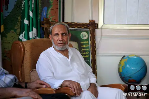 Palestinian Hamas leader Mahmoud al-Zahar recieves congratulations of Eid al-Fitr at his house in Gaza city, Aug. 20, 2012. which marks the end of the Muslim fasting month of Ramadan. Eid, one of the most important holid...
