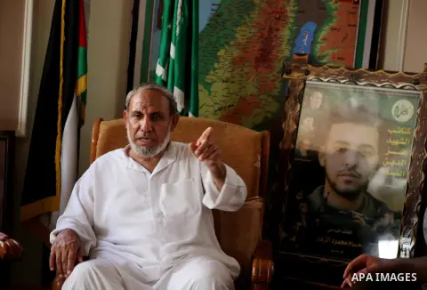 Palestinian Hamas leader Mahmoud al-Zahar recieves congratulations of Eid al-Fitr at his house in Gaza city, Aug. 20, 2012. which marks the end of the Muslim fasting month of Ramadan. Eid, one of the most important holid...