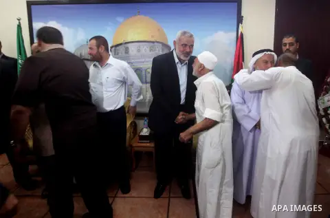 Palestinian Prime Minister in Gaza Ismail Haniyeh recieves congratulations of Eid al-Fitr in Gaza city, Aug. 20, 2012. which marks the end of the Muslim fasting month of Ramadan. Eid, one of the most important holidays i...