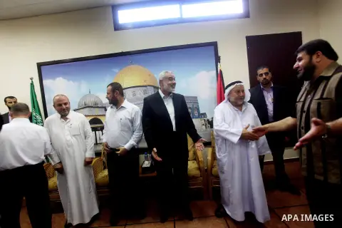 Palestinian Prime Minister in Gaza Ismail Haniyeh recieves congratulations of Eid al-Fitr in Gaza city, Aug. 20, 2012. which marks the end of the Muslim fasting month of Ramadan. Eid, one of the most important holidays i...
