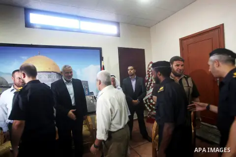 Palestinian Prime Minister in Gaza Ismail Haniyeh recieves congratulations of Eid al-Fitr in Gaza city, Aug. 20, 2012. which marks the end of the Muslim fasting month of Ramadan. Eid, one of the most important holidays i...