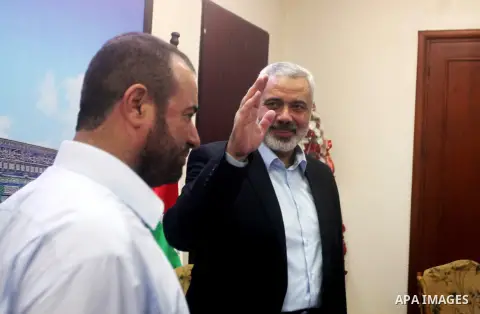 Palestinian Prime Minister in Gaza Ismail Haniyeh recieves congratulations of Eid al-Fitr in Gaza city, Aug. 20, 2012. which marks the end of the Muslim fasting month of Ramadan. Eid, one of the most important holidays i...