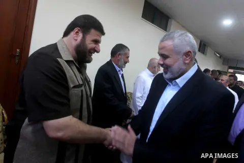 Palestinian Prime Minister in Gaza Ismail Haniyeh recieves congratulations of Eid al-Fitr in Gaza city, Aug. 20, 2012. which marks the end of the Muslim fasting month of Ramadan. Eid, one of the most important holidays i...