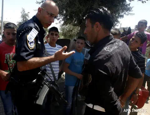 Israeli soldiers take position during a confiscated to horses for Palestinian boys in Jerusalem, on August 21, 2012. Photo by Mahfouz Abu Turk.