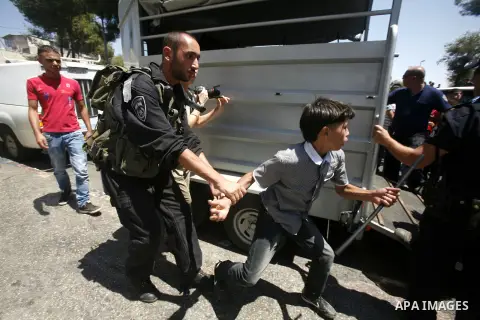 Israeli soldiers take position during a confiscated to horses for Palestinian boys in Jerusalem, on August 21, 2012. Photo by Mahfouz Abu Turk.