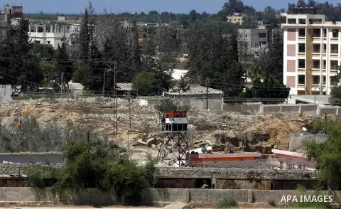 A view of soldiers from the Egyptian army destroying the infrastructure of smuggling tunnels along the Egypt-Gaza border is seen from Rafah, southern Gaza Strip, on August 22, 2012, as sources in Cairo suggested some of...