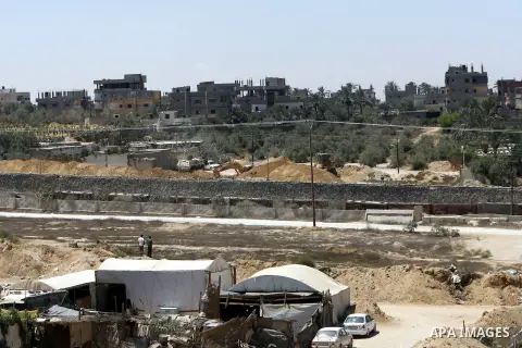 A view of tents covering the smuggling tunnels along the Egypt-Gaza border is seen from Rafah, southern Gaza Strip, on August 22, 2012, as Egyptian soldiers destroy the infrastructure of the tunnels on the Egyptian side...