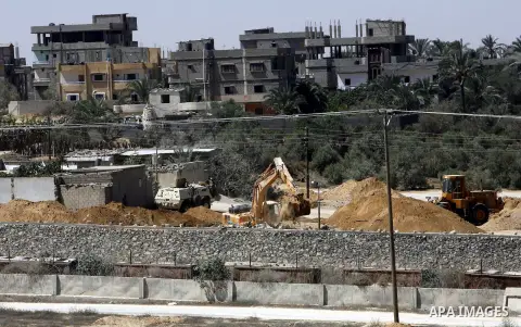 A view of soldiers from the Egyptian army destroying the infrastructure of smuggling tunnels along the Egypt-Gaza border is seen from Rafah, southern Gaza Strip, on August 22, 2012, as sources in Cairo suggested some of...