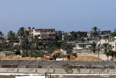 A view of soldiers from the Egyptian army destroying the infrastructure of smuggling tunnels along the Egypt-Gaza border is seen from Rafah, southern Gaza Strip, on August 22, 2012, as sources in Cairo suggested some of...