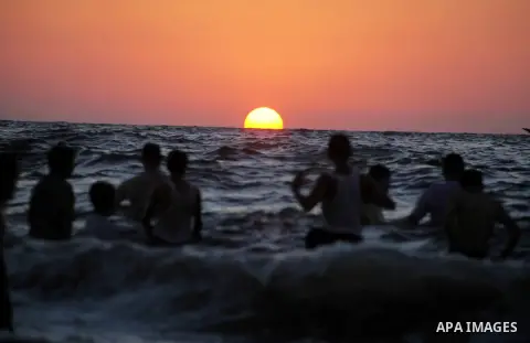 Palestinians enjoy swimming in the sea at Gaza beach during Friday holiday in Gaza city, Aug 24, 2012. Gazans escape to the beach and out from their homes during heat wave and power outages. Photo by Ashraf Amra