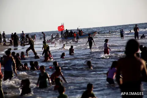 Palestinians enjoy swimming in the sea at Gaza beach during Friday holiday in Gaza city, Aug 24, 2012. Gazans escape to the beach and out from their homes during heat wave and power outages. Photo by Ashraf Amra