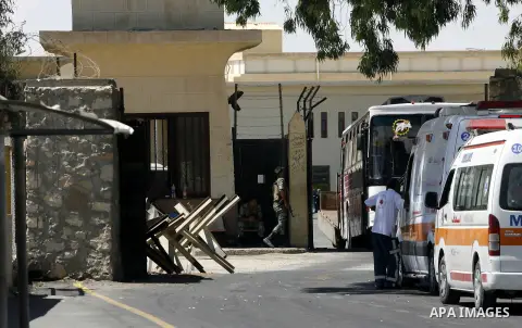 Ambulance enters into Egypt at the Rafah border crossing in the southern Gaza strip, 25 August 2012. Egypt allowed some Palestinians to enter its territory from Gaza. Photo by Eyad Al Baba
