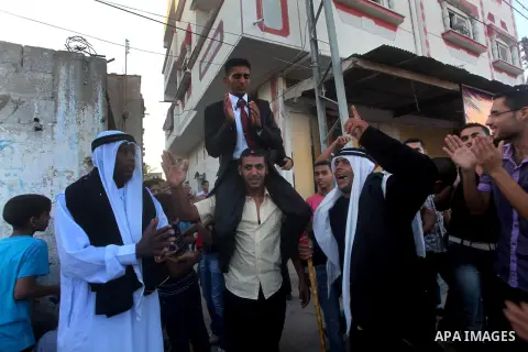 Palestinian friends and relatives celebrated the groom, Salah Khatab 25 years old, in ,Dear El-Balah, southern Gaza Strip on the eve of his wedding on August. 25, 2012, during the traditional celebration, Khatab was firs...