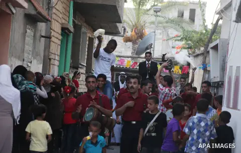 Palestinian friends and relatives celebrated the groom, Salah Khatab 25 years old, in ,Dear El-Balah, southern Gaza Strip on the eve of his wedding on August. 25, 2012, during the traditional celebration, Khatab was firs...