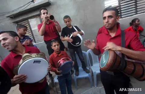 Palestinian friends and relatives celebrated the groom, Salah Khatab 25 years old, in ,Dear El-Balah, southern Gaza Strip on the eve of his wedding on August. 25, 2012, during the traditional celebration, Khatab was firs...