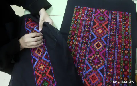 Deaf Palestinian women work on embroidery at Atfaluna Society for Deaf Children in Gaza City, on Aug. 26, 2012. The society provides services for about 15,000 deaf youth on education, training programs and income generat...