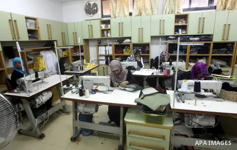 Deaf Palestinian women work on embroidery at Atfaluna Society for Deaf Children in Gaza City, on Aug. 26, 2012. The society provides services for about 15,000 deaf youth on education, training programs and income generat...