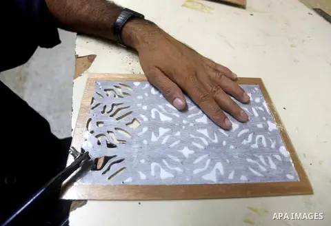Deaf Palestinian men work on joinery at Atfaluna Society for Deaf Children in Gaza City, on Aug. 26, 2012. The society provides services for about 15,000 deaf youth on education, training programs and income generating p...