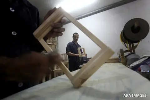 Deaf Palestinian men work on joinery at Atfaluna Society for Deaf Children in Gaza City, on Aug. 26, 2012. The society provides services for about 15,000 deaf youth on education, training programs and income generating p...