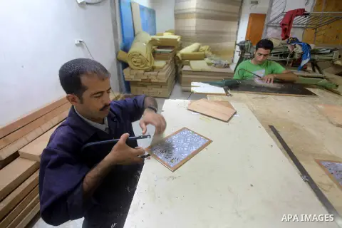 Deaf Palestinian men work on joinery at Atfaluna Society for Deaf Children in Gaza City, on Aug. 26, 2012. The society provides services for about 15,000 deaf youth on education, training programs and income generating p...