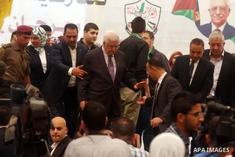 Palestinian President Mahmoud Abbas ( Abu Mazen ) attends a graduation ceremony for high school students in the West Bank city of Ramallah, Sunday, Aug 26, 2012. Photo by Issam Rimawi
