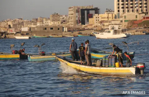 Palestinian fishermen work on their boats at the port of Gaza city on Aug 26, 2012. The ship Estelle, which leads the Freedom Flotilla will reach the Gaza port from San Sebastian, Basque Country, northern Spain within da...