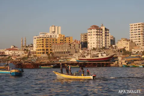 Palestinian fishermen work on their boats at the port of Gaza city on Aug 26, 2012. The ship Estelle, which leads the Freedom Flotilla will reach the Gaza port from San Sebastian, Basque Country, northern Spain within da...