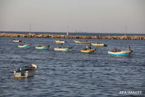 Palestinian fishermen work on their boats at the port of Gaza city on Aug 26, 2012. The ship Estelle, which leads the Freedom Flotilla will reach the Gaza port from San Sebastian, Basque Country, northern Spain within da...