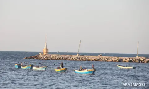 Palestinian fishermen work on their boats at the port of Gaza city on Aug 26, 2012. The ship Estelle, which leads the Freedom Flotilla will reach the Gaza port from San Sebastian, Basque Country, northern Spain within da...