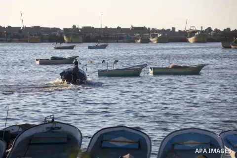 Palestinian fishermen work on their boats at the port of Gaza city on Aug 26, 2012. The ship Estelle, which leads the Freedom Flotilla will reach the Gaza port from San Sebastian, Basque Country, northern Spain within da...