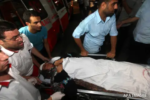 Nadia Salama Al-Rash, a wounded Palestinian women from al-Zeitoun neighborhood in Gaza city is wheeled into a hospital following an Israeli air strike on Aug 28, 2012. The Israeli air strike targeted al-Safina and Badr s...