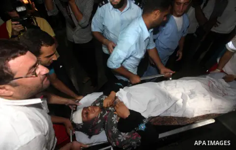 Nadia Salama Al-Rash, a wounded Palestinian women from al-Zeitoun neighborhood in Gaza city is wheeled into a hospital following an Israeli air strike on Aug 28, 2012. The Israeli air strike targeted al-Safina and Badr s...