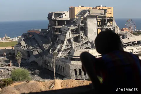 Palestinians inspect the damage at a Hamas training camp following an Israeli airstrike in Gaza City, early Tuesday, Aug. 28, 2012. Palestinian militants fired rockets towards Israel on Monday. Photo by Majdi Fathi