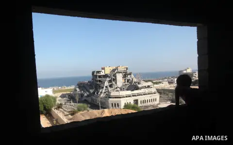 Palestinians inspect the damage at a Hamas training camp following an Israeli airstrike in Gaza City, early Tuesday, Aug. 28, 2012. Palestinian militants fired rockets towards Israel on Monday. Photo by Majdi Fathi