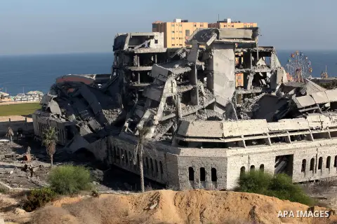 Palestinians inspect the damage at a Hamas training camp following an Israeli airstrike in Gaza City, early Tuesday, Aug. 28, 2012. Palestinian militants fired rockets towards Israel on Monday. Photo by Majdi Fathi