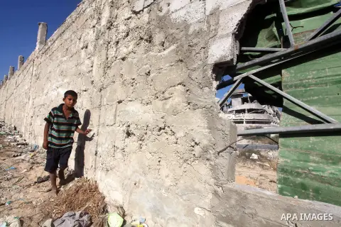 Palestinians inspect the damage at a Hamas training camp following an Israeli airstrike in Gaza City, early Tuesday, Aug. 28, 2012. Palestinian militants fired rockets towards Israel on Monday. Photo by AshrAF Amra