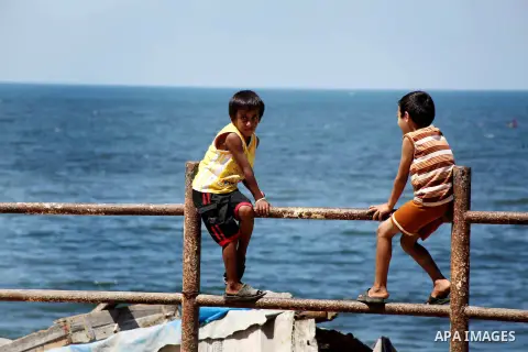 Palestinian children enjoy seeing on the sea at Gaza beach on August 28, 2012. Life in the poor and crowded Gaza Strip is going to get harsher still unless action is taken now, according to a new United Nations report re...