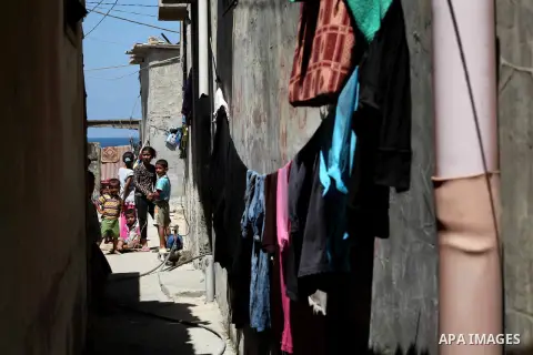 Palestinian children gather in an alley in Al-Shati refugee camp in Gaza City on August 28, 2012. Life in the poor and crowded Gaza Strip is going to get harsher still unless action is taken now, according to a new Unite...