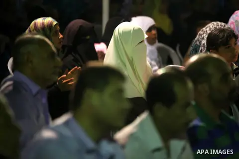 Palestinians listen to sufis songs performed by Sufi artists during celebration in Gaza city on Aug 28, 2012. Mystic songs symbolizing peace, brotherhood and love. Photo by Majdi Fathi