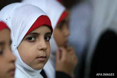 Palestinian girls listen to sufis songs performed by Sufi artists during celebration in Gaza city on Aug 28, 2012. Mystic songs symbolizing peace, brotherhood and love. Photo by Majdi Fathi