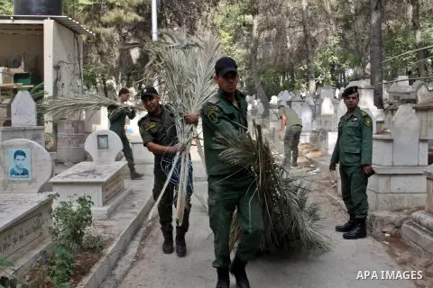 Palestinian security members volunteer clean the cemeteries during the campaign "Cleanliness " in the West Bank city OF Nablus, on Aug. 29, 2012. Photo by Nedal Eshtayah