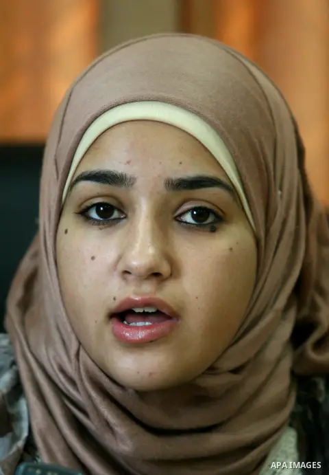 Palestinian mayor teenager Bashaer Othman, 15, sits behind her desk at the town hall of the West Bank village of Allar, north of Tulkarem, on August 30, 2012. Othman became mayor as part of a program from Allar's municip...