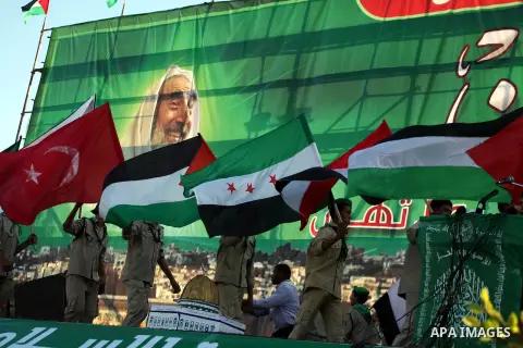 Palestinian boy scouts hold Islamic countries flags during a festival entitled "Jerusalem in our eyes"organized by Hamas movement, marking the 43rd anniversary of burning down al-Aqsa mosque in Gaza city on 30 Aug 2012....