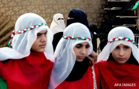 Palestinian girls take part in a festival entitled "Jerusalem in our eyes" organized by Hamas movement, marking the 43rd anniversary of burning down al-Aqsa mosque in Gaza city on 30 Aug 2012. The Australian Jewish Denni...
