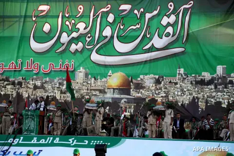 Palestinian boy scouts hold Islamic countries flags during a festival entitled "Jerusalem in our eyes"organized by Hamas movement, marking the 43rd anniversary of burning down al-Aqsa mosque in Gaza city on 30 Aug 2012....