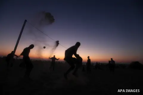 Palestinians play beach volleyball during the last Friday holiday before the beginning of new school year in Gaza city, Aug 31, 2012. Next Sunday is the First day for the new school year according to Palestinian Ministry...