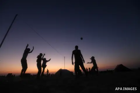 Palestinians play beach volleyball during the last Friday holiday before the beginning of new school year in Gaza city, Aug 31, 2012. Next Sunday is the First day for the new school year according to Palestinian Ministry...