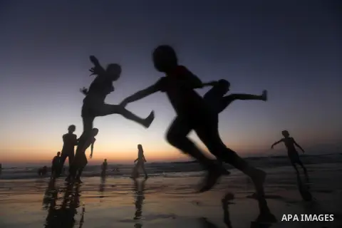 Palestinian children play at the beach during the last Friday holiday before the beginning of new school year in Gaza city, Aug 31, 2012. Next Sunday is the First day for the new school year according to Palestinian Mini...